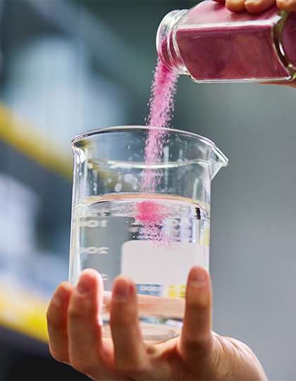 Sensient-website-420x540_0000s_0041-scientist-handing-materials-11-liquid-powder