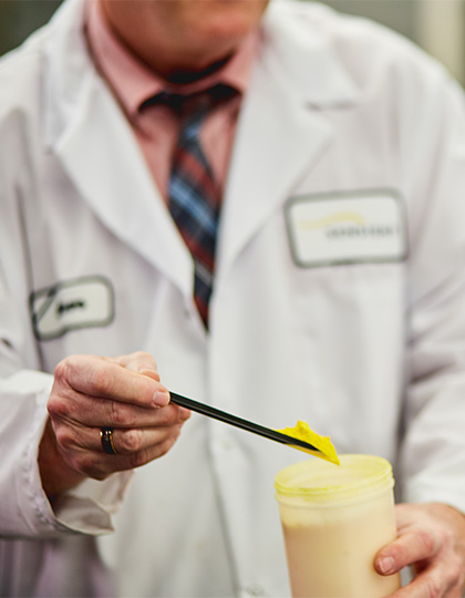 Sensient-website-420x540_0000s_0044-scientist-handing-materials-06-powder